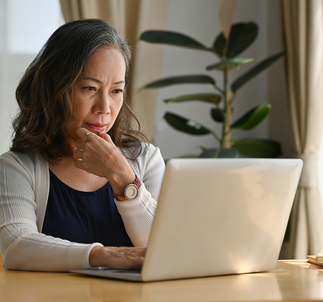 woman looking at laptop