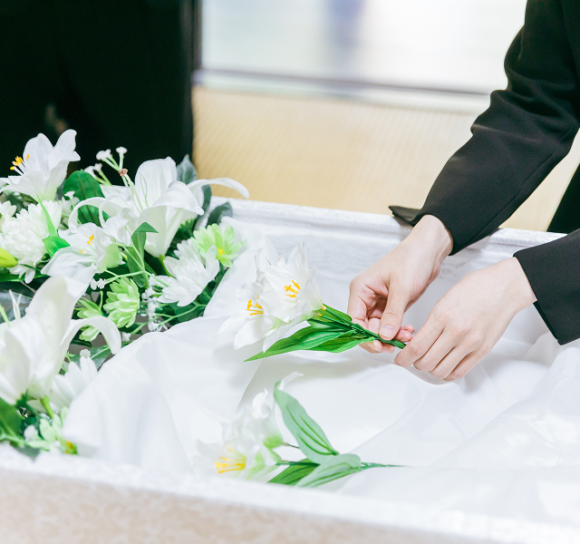 person laying flowers
