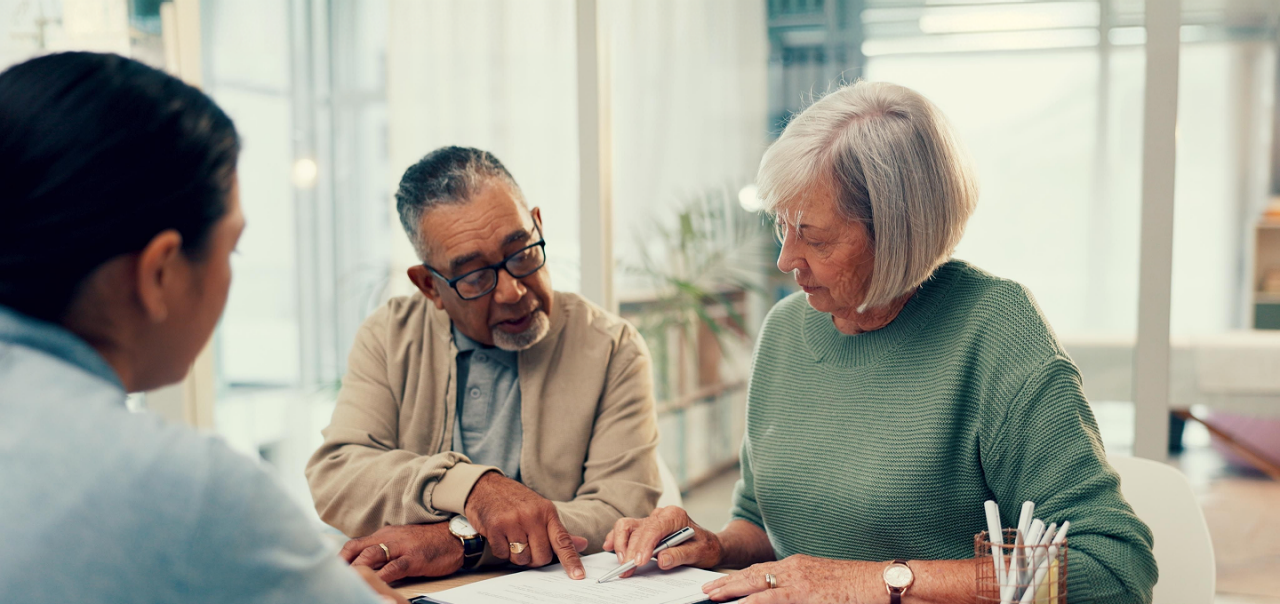 a man and woman planning with funeral director